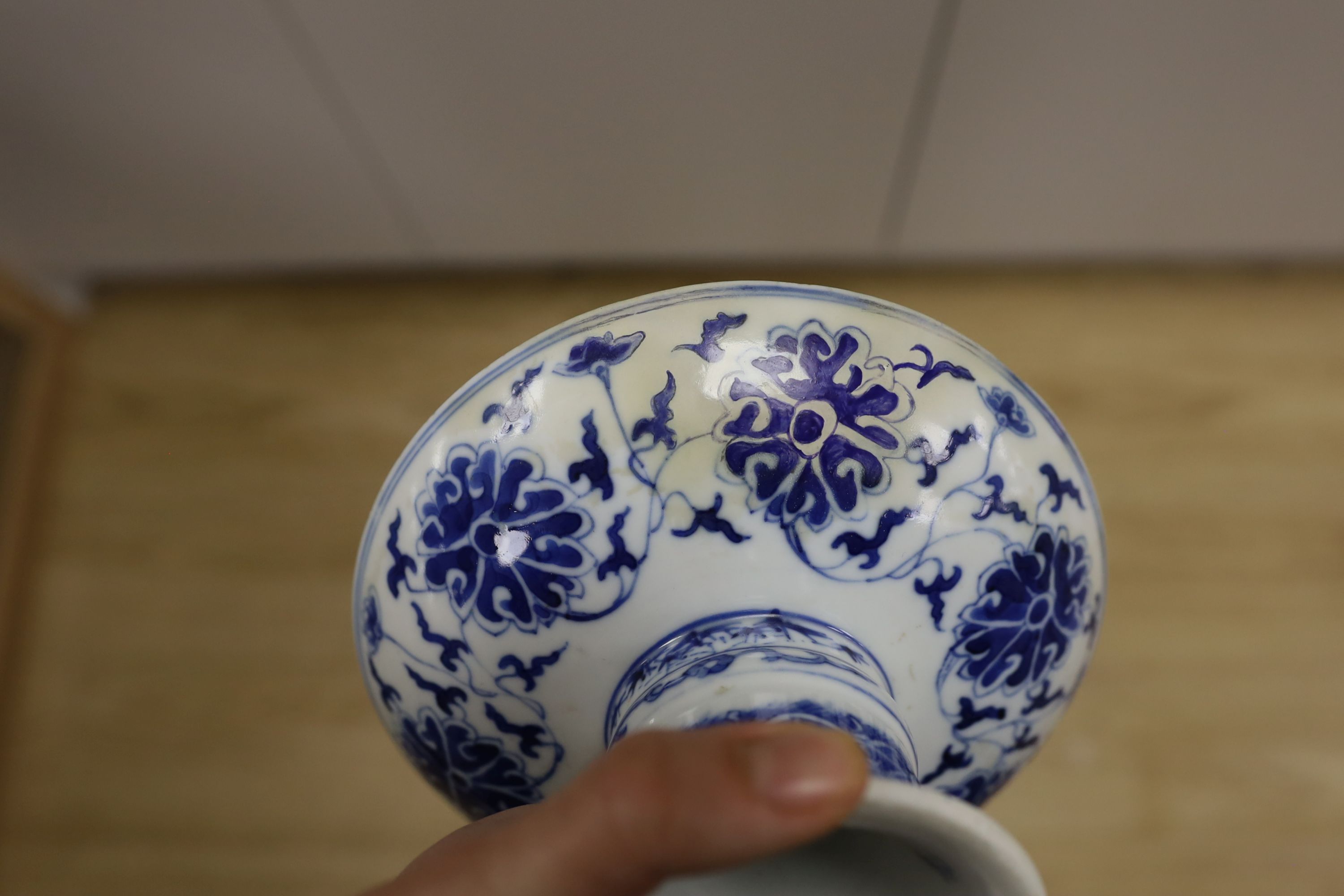 A Chinese underglaze copper red ‘herder and goats’ vase, Kangxi six character mark but Republic period and a Chinese blue and white lotus stem dish, six character Guangxu mark and period, both damaged
